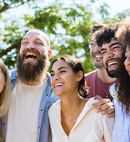 Patient in Bozeman smiling with friends while wearing ClearCorrect aligners 